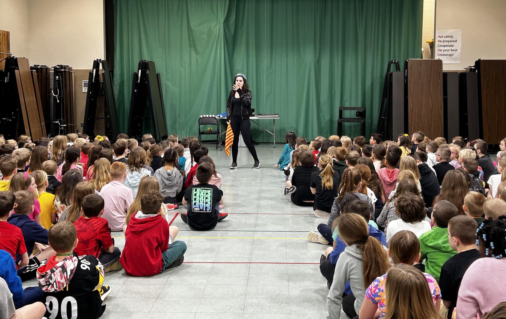 “The Starry Messenger”, Lindsay Surmacz, captivates the students with a circus-themed assembly
