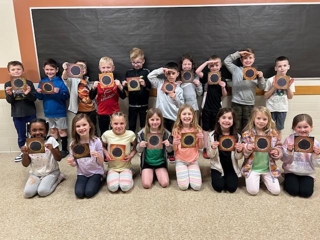 Mrs. Kelly’s 1st-grade class displays their finished artwork