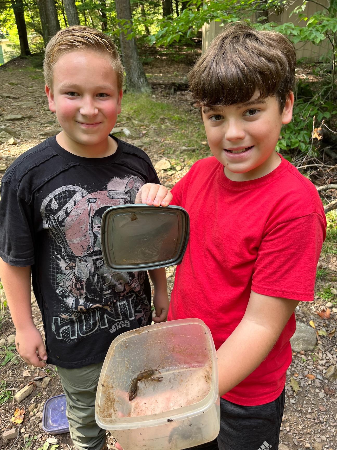 Ben Nicolosi and Zach Roland from McCullough know the best place to find creatures is under rocks in the creek