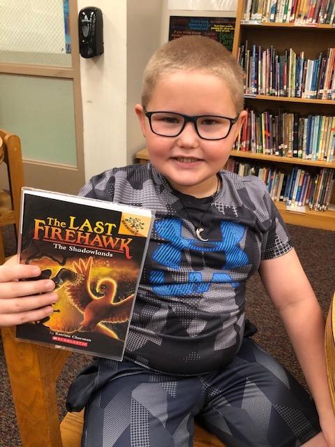 Second-grader Paul Lee is very happy with the new book selection
