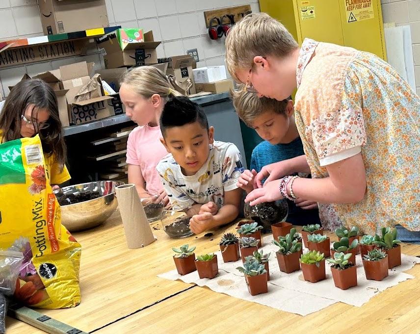 Students learn about different types of succulent plants from volunteer Ella Welsch, a recent PTHS graduate