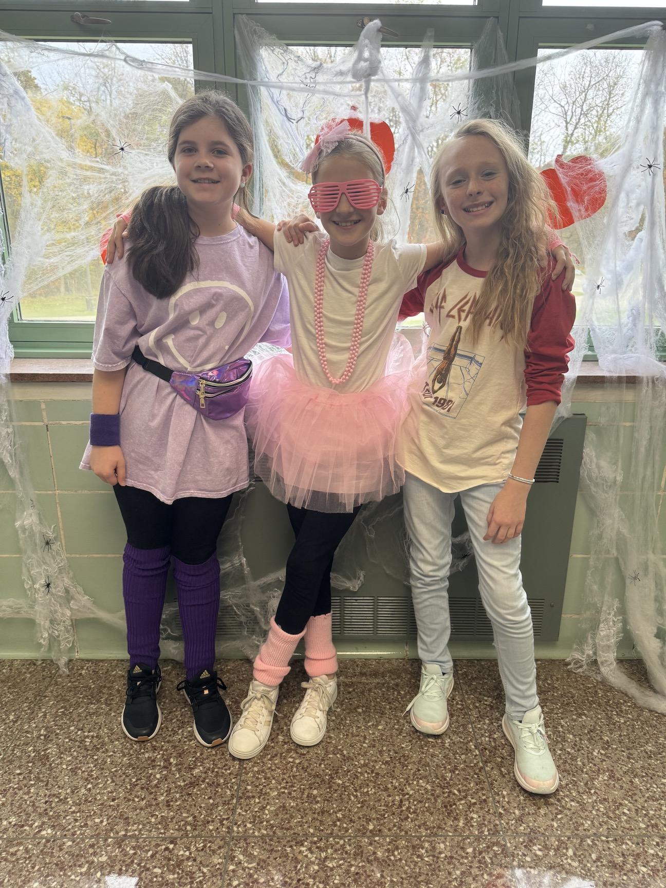 Trafford Middle School students Rebecca Tirpak, Laney Rosenberry, and Zoey Wade dress in 80s & 90’s theme to represent “Drugs are so old”