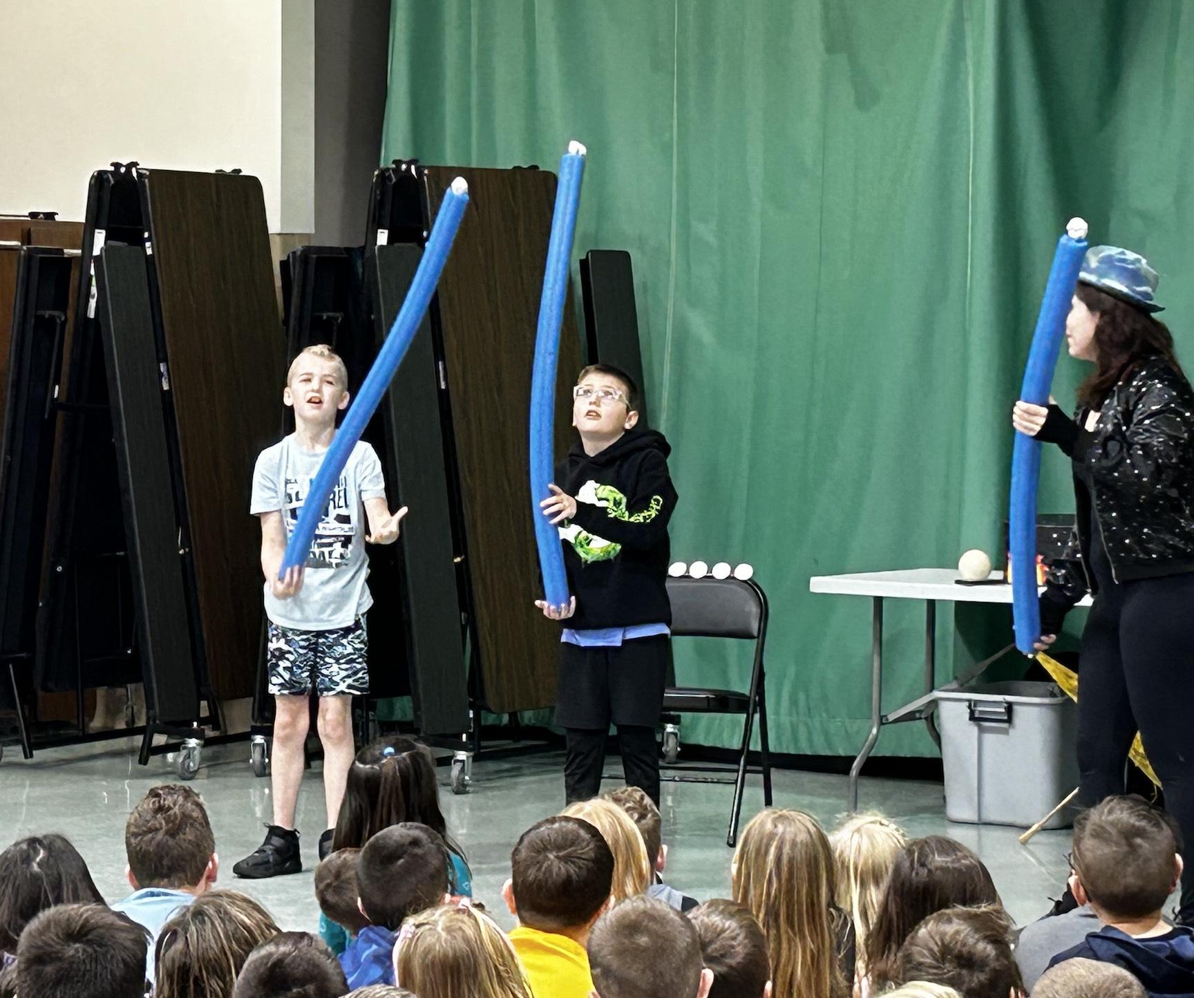 Nico Kramer and Jackson Bost practice balancing their “stars” during the assembly